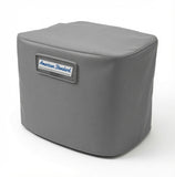 Gray American Standard 2A7A series air conditioner cover installed on outdoor unit in backyard setting